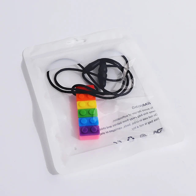 Mordedor Sensorial Lego Arcoíris – Collar de Silicona para Masticar (Niños y Bebés con Hipersensibilidad Oral)